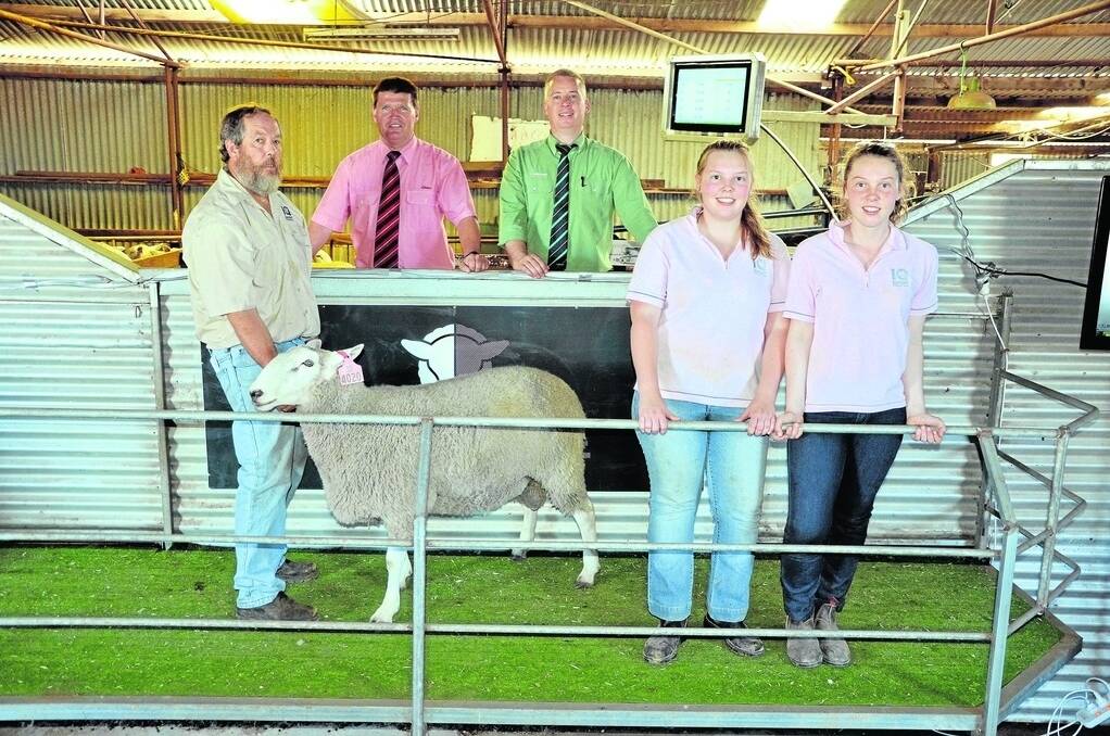 Inverbrackie stud principal Lynton Arney and daughters Ellen, 17, and Lauren, 15, with the sale team of Elders’ Tony Wetherall and Landmark’s Gordon Wood, with one of the $2500 top price rams.