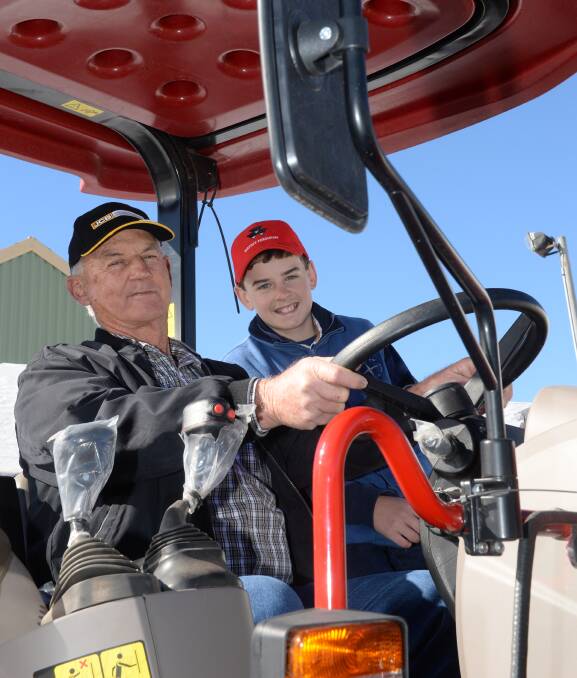 Paul Russell, "Hillview", Mount Thorley, was keen to check out a Case IH Farmall tractor with Heath Russell, 13, at the Mudgee Small Farm Field Days over the weekend. Photo by Rachael Webb. 