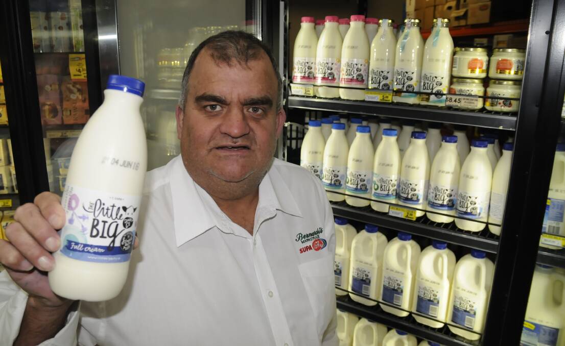 BIG SELLER: Bernardi’s IGA store manager Geoff Bottom says customers’ support for struggling dairy farmers is evident by a recent jump in premium milk sales. Photo: CHRIS SEABROOK 052316cigamilk