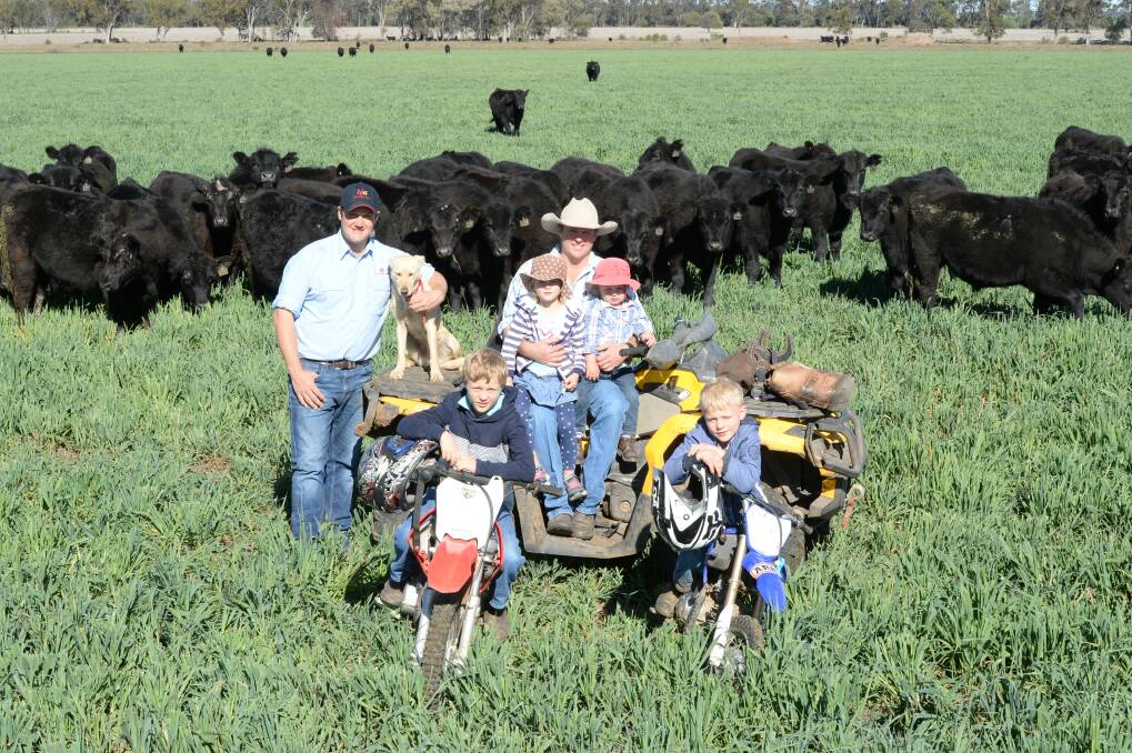 Bob Jamieson Agencies director, Ben Hiscox, Dobikin Pastoral Company owner-operator, Rob Vickery, and children Tom, 9, Roger, 7, Penny, 5 and Campbell 2.