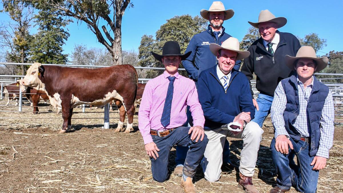 The $26,000 top price bull with vendor Ben Spencer, auctioneer Paul Dooley and Hugh Spencer in the front row while Charlie Hart of Hart Rural Agencies and Howard Carter of Nutrien Ag Solutions stand behind them. 