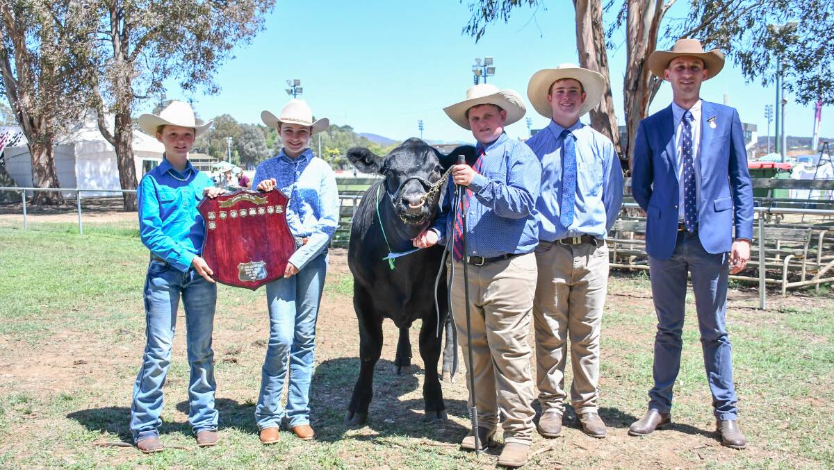 The champion open steer and grand champion hoof and hook steer with trophy presenters Chloe Long and Sienna Pearce, owners Edward and Hamish Maclure and judge Sam Hunter. 