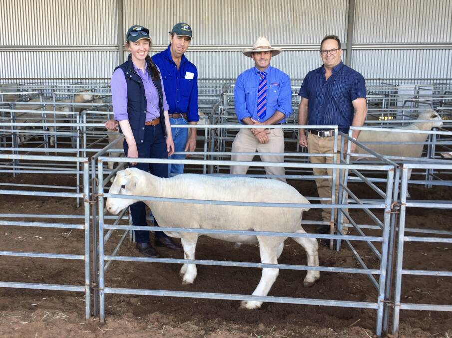 Laura and Scott Woodley, John Hyland from Peter Milling and Co and purchaser Craig French with the top price ram. Photo: Supplied