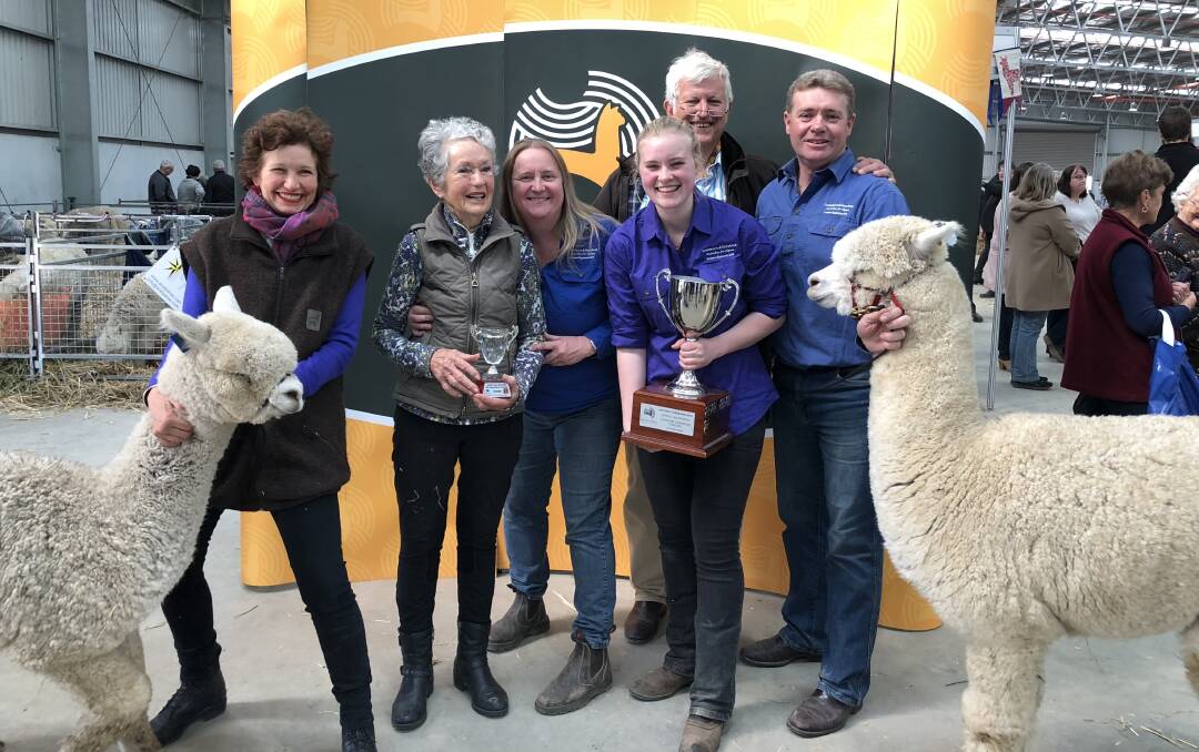 Janie Forrest and EP Cambridge Connoisseur, with Judith Street, Karen, Rubey and Michael Williams of Storybook Alpacas holding Coolaroo Mercado and Ian Davison.