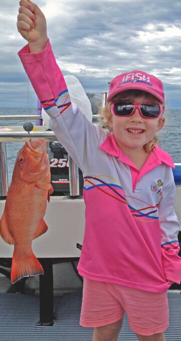 Lily Butler holding her first coral trout caught off Cairns in Queensland. If you have a great fishing picture send it to joshandjamiefishing@gmail.com