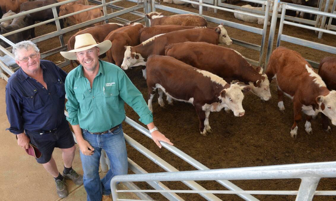 Cliff Healey, "Hillside", Parkes, sold yearling steers for $1120 at the Forbes sale last Friday. He is pictured with Geoff Rice, Langlands Hanlon, Parkes.