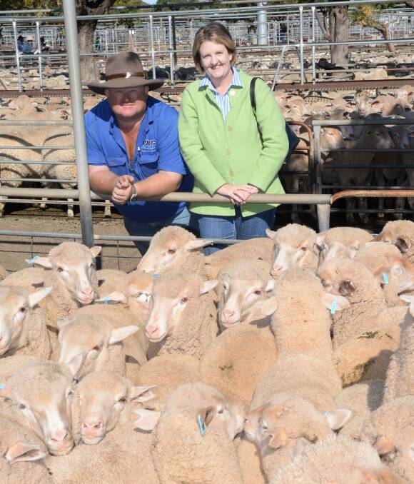 Peter and Kim Griffiths, "Karim", Narromine, with a pen of Dohne lambs they sold for $131 a head at the Dubbo prime lamb sale on Monday.