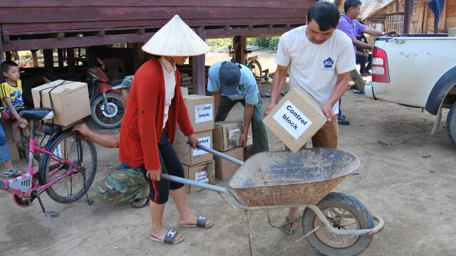 Molasses blocks being distributed in Laos.