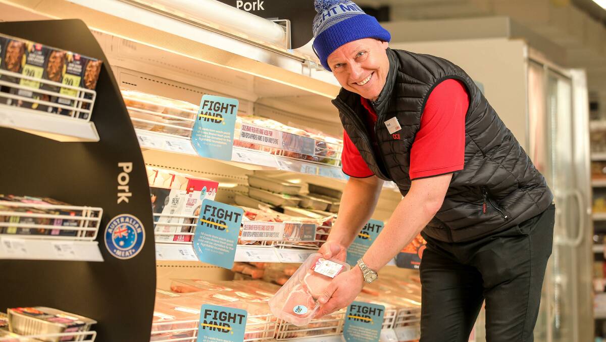 Coles chief operating officer Matt Swindells with Coles Brand fresh pork helping in the fight against Motor Neurone Disease.