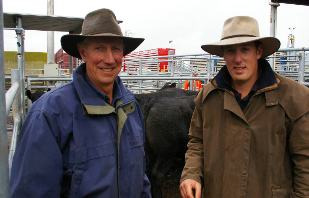 Ballarat stock agent Lachie Shaw, TB White & Sons, with his father Greg Shaw, Newlyn, with their Angus steers, 450kg, which sold for $1430 a head at Ballarat. 