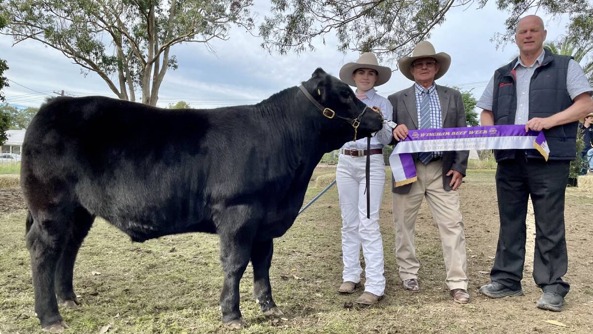 St Joseph's High School student Elizabeth Gardiner with her Limousin cross Angus steer that took out the grand champion led steer or heifer at Wingham Beef Week. Pictured with judge Chris Knox and Chris Black from Wingham Exports