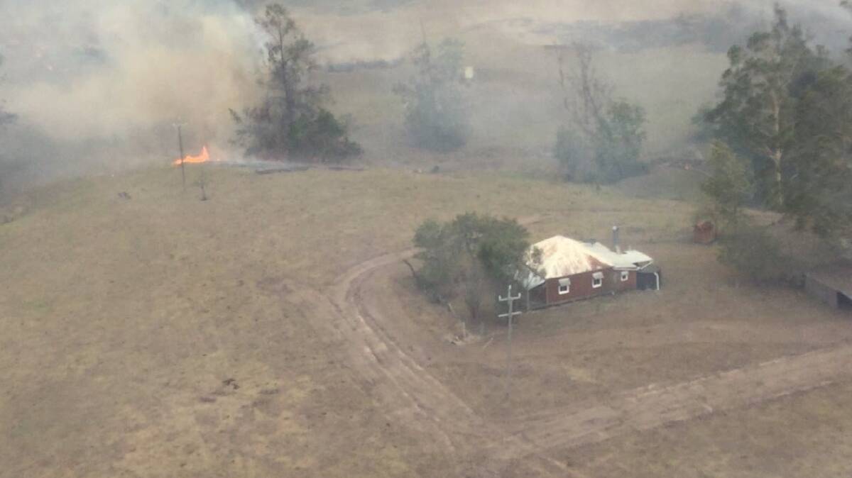 It took a concentrated effort from landholders and emergency services to save Slim Dusty's childhood home. Photo: Air Observer 