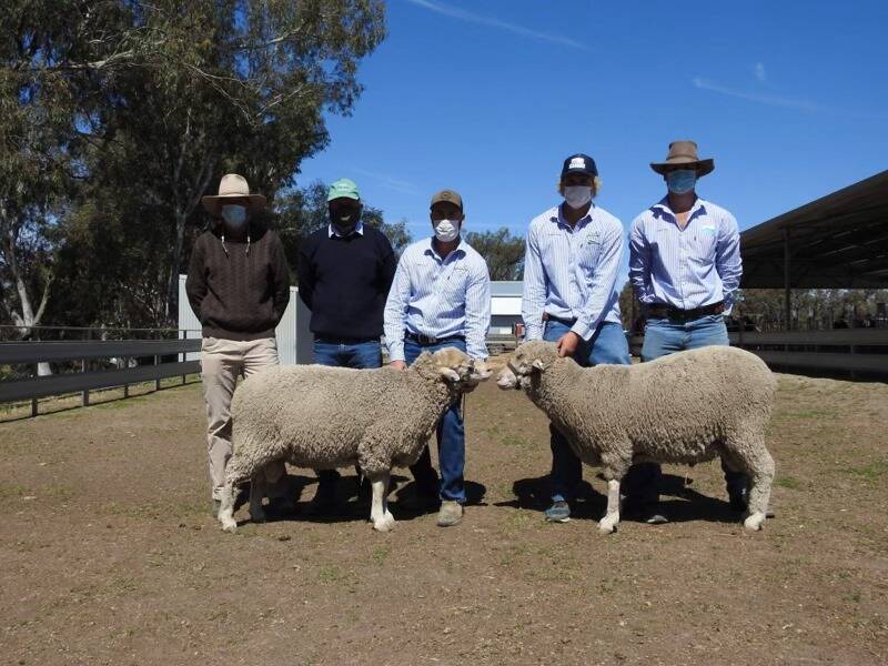Tom Holt from Coonong Station, Urana, stud master Jason Southwell, stud grooms Jake Pyle and Harry Agar and stud principal Sandy Pye with the top rams. Photo: Calga