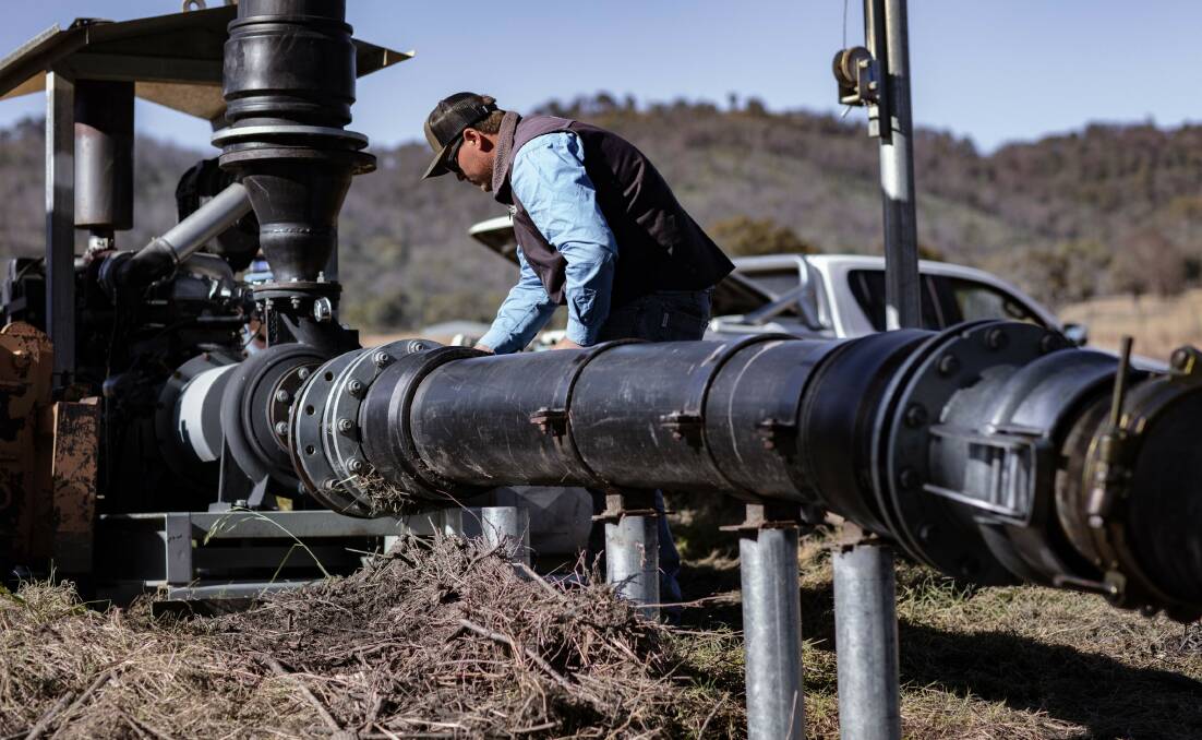 An NRAR staff member inspects an on-property pump and pipeline. Picture supplied by NRAR 