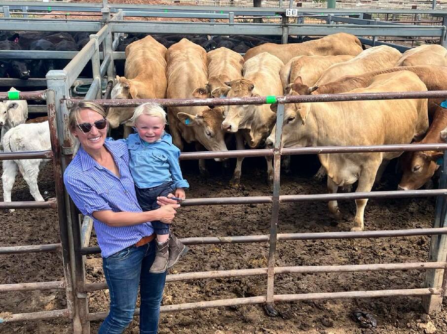 Allana Bowman, Shingle Hut, Dunedoo, and son Leo, 20 months, sold cows with calves for $3980 a unit at Dunedoo last Friday. 