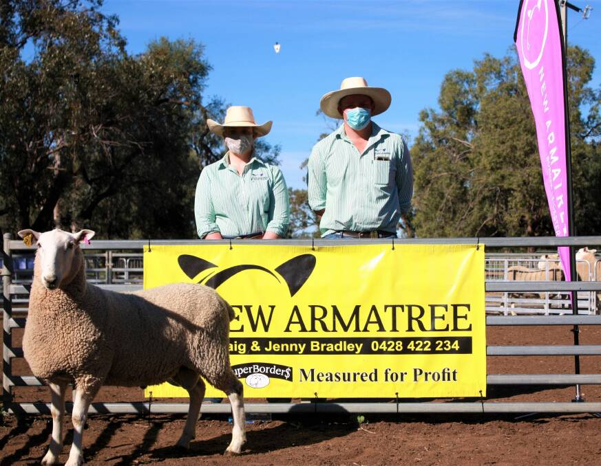 Peta and Jack Bradley, New Armatree Border Leicester stud, Armatree, with the sale-topping $8,000 New Armatree-200133 purchased by Crown Agriculture, Cudal. 
