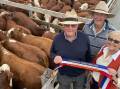 Cam and Carol Emerson, Alva Downs, Tahara, sold 120 Hereford steers at Casterton, including the best presented Herefords Australia pen with 25 steers, 396kg. Pictured with Herefords Australia judge Greg Farquharson, Bushy Park Angus, Capaul Station, Dergholm (middle).