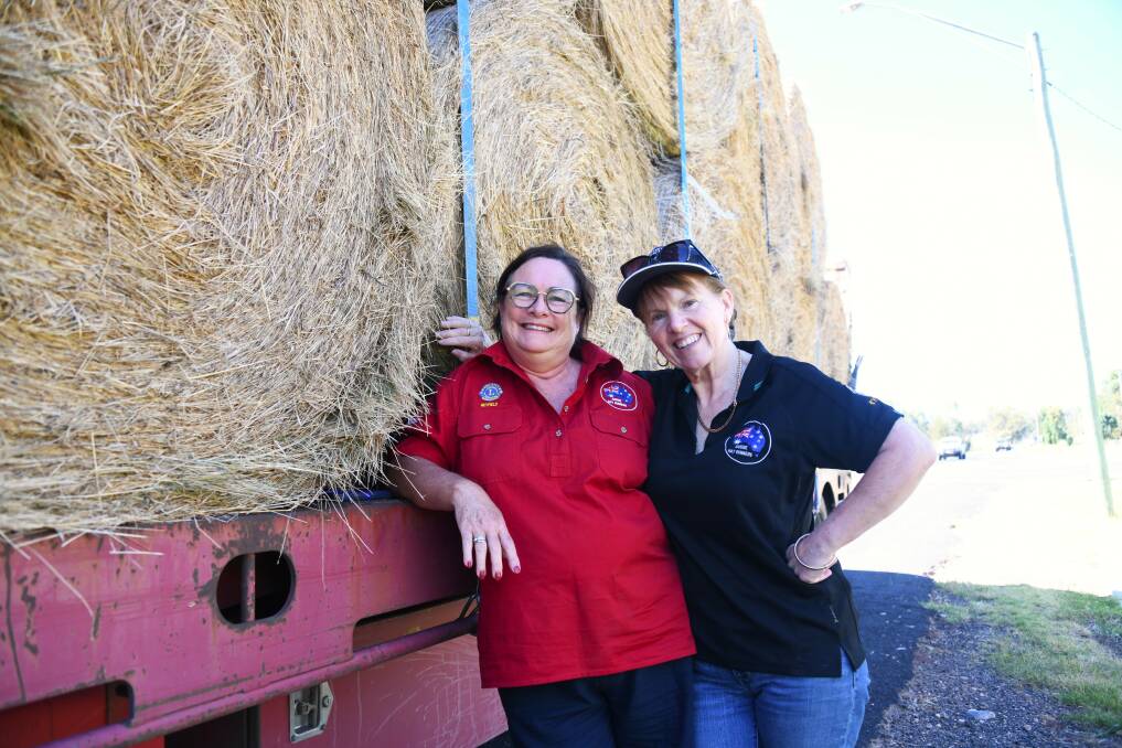 Aussie Hay Runners volunteers Anne-Marie Best and Linda Widdup with a truck carrying hay. Picture by Amy McIntyre