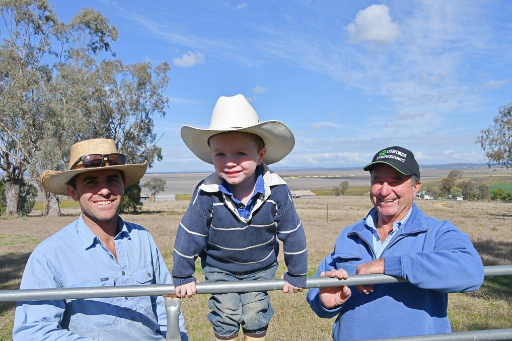 James, Archie, 3, and Andrew Pursehouse are part of the three generations working the family's farmland, which would have been surrounded by Shenhua's Watermark coal mine. Photo by Billy Jupp 