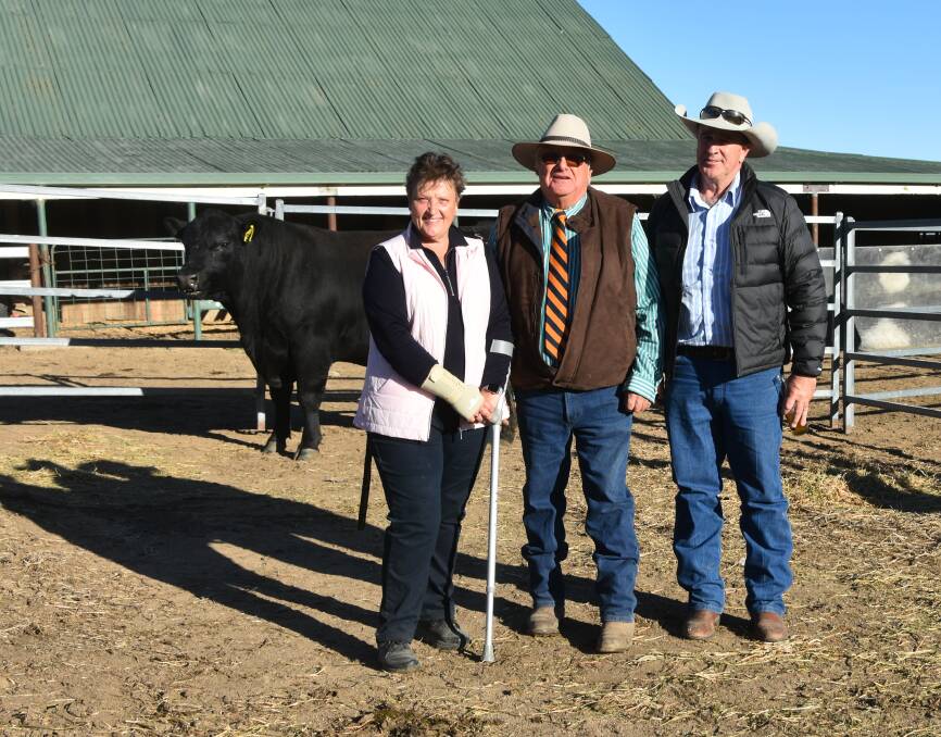 Second highest bull selling for $44,000 with Sally and Greg Chappel ,Dulverton alongside buyer John Sylvester, Five Star Angus.