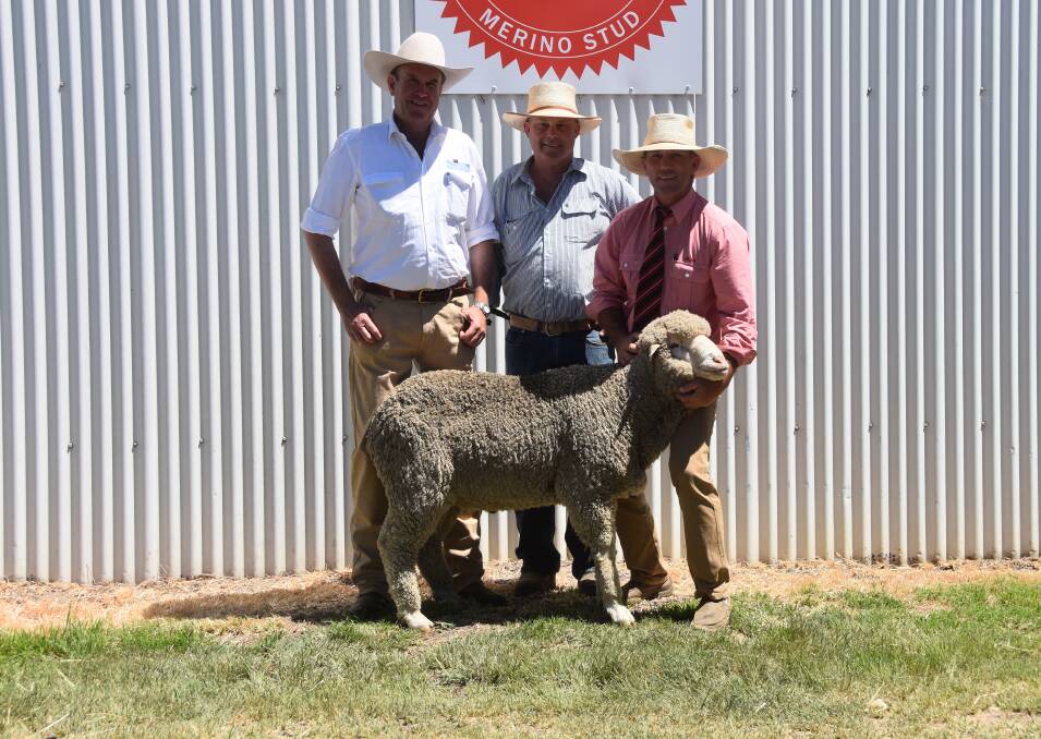 Auctioneer Paul Dooley alongside Hamish McLaren, Nerstane, and Shane Rule, Elders, with the $2000 charity ram donated to the Westpac Helicopter Service. 