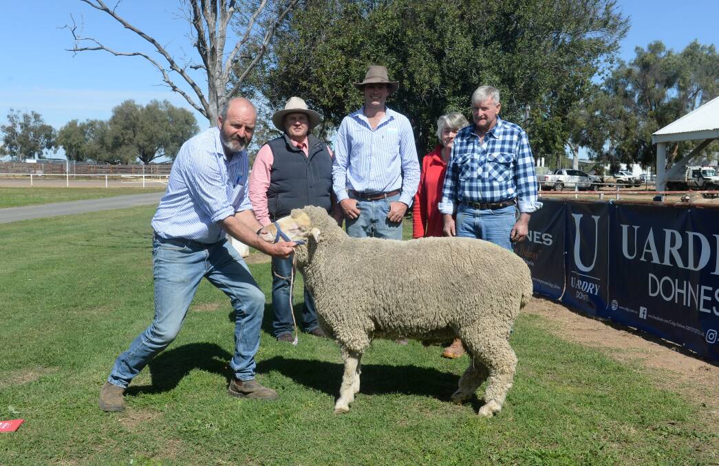 Calga's Studmaster Jason Southwell, Matt Prentice, Elders Coonamble, Sandy Pye, Calga, Coonamble, and purchasers Colleen and Les Tumpey, Tullamore, with the $6000 top priced ram. Photo: Kate Loudon.