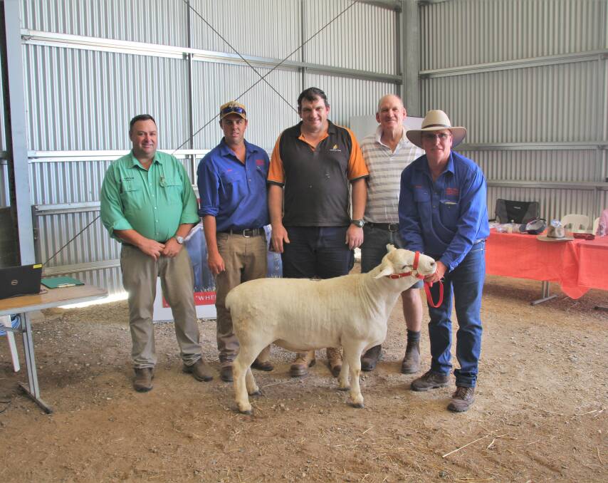 The $9000 sale-topping ram with Nutrien stud stock agent Brad Wilson, Dubbo, vendors Ethan and Robert (right) Endacott, Red Hill, Wongarbon, and buyers Adam and Robert Barbar, Black Rose, Parkes.
