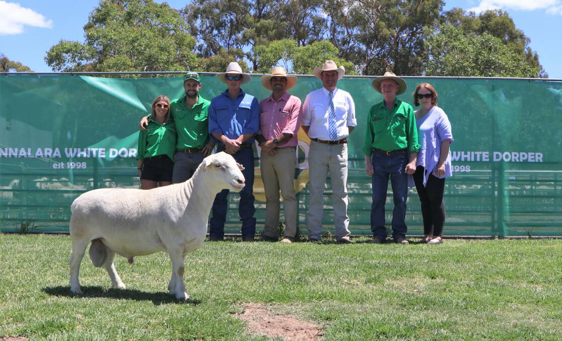 Annalara's Isabel Torres and Jack Cresswell, Tom McCumstie, Goodooga, Martin Simmons, Elders Dubbo, auctioneer Paul Dooley, and Steve Cresswell with the equal top-priced ram AWD 210292 Glamour.