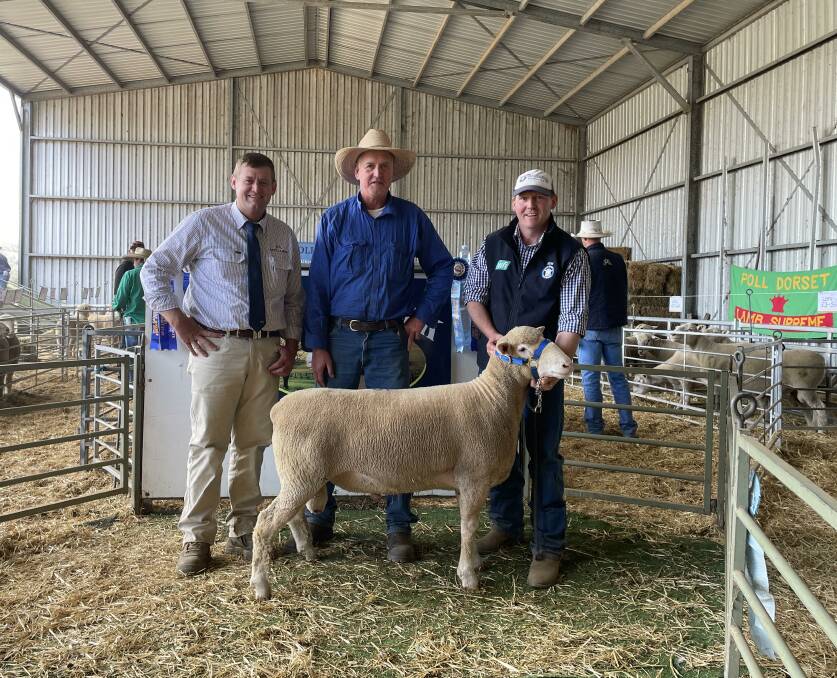 Auctioneer Daniel McCulloch, McCulloch Agencies, Ben Atkinson, Fairlight, Narrabri and Abelene Park stud co-principal Marshall Douglas with the $5000 top-priced ram.