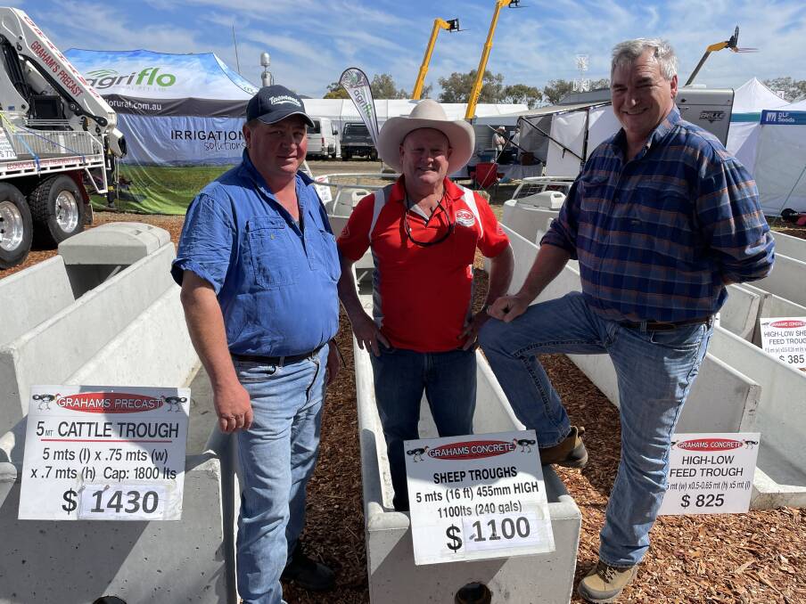 Jamie Marquet, The Willows, Dungog, Peter Graham, Grahams Precast, Kyogle and Daryl Berry, Dungog, talk stock troughs at AgQuip.