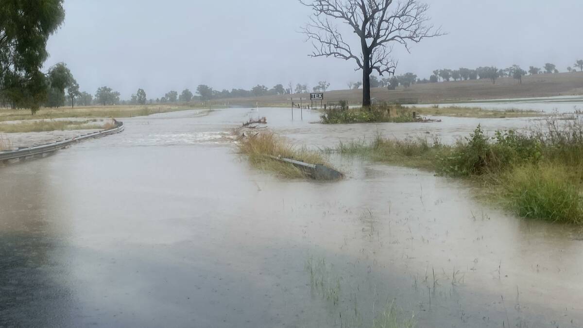 The front gate to the Mayne family's Texas Angus property at Warialda on Friday afternoon. They measured 182mm of rain on Friday and Saturday morning. Picture supplied by Wendy Mayne