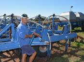 Scott Doyle, Olinga, Somerton, greases his air seeder in anticipation of his paddocks drying up to permit the planting of more than 280 hectares of bread and durum wheat.