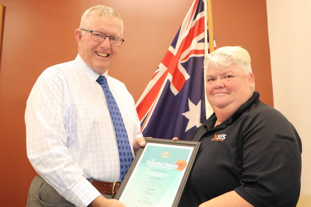 Parkes MP presents Moree family with certificates of appreciation as part of Anzac Day commemorations.
