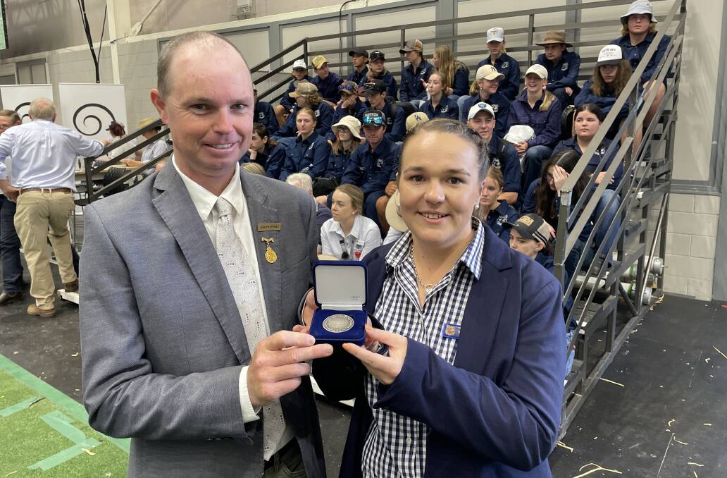 RAS sheep and wool committee chair Joseph Byrnes presents Trundle Central School agriculture teacher Heather Earney with the RAS Youth Medal. Picture by Simon Chamberlain