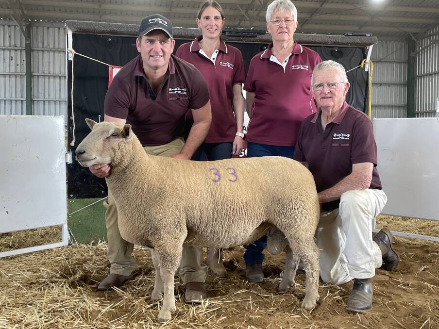 The Mitchell family, Rene stud, with the top-priced Charollais ram sold for $10,500 at Culcairn on Friday. 