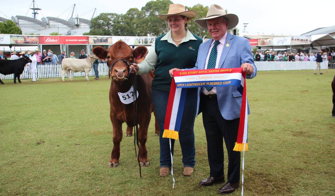 Chloe Bailey, Wagga Wagga, and immediate past RAS president Michael Milner, Blayney, with the champion lightweight steer. Picture by Alexandra Bernard. 