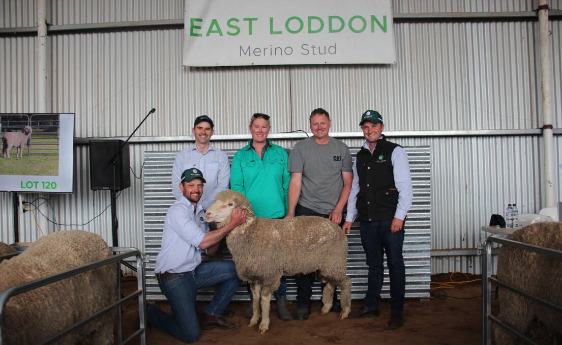 Jacob Davies, AWN, buyers Lynette and Travis Fernandes, Winjallok, Vic, Marcus Hooke, East Loddon, and front Tom Hooke, East Loddon, with the top-priced ram sold for $5500.