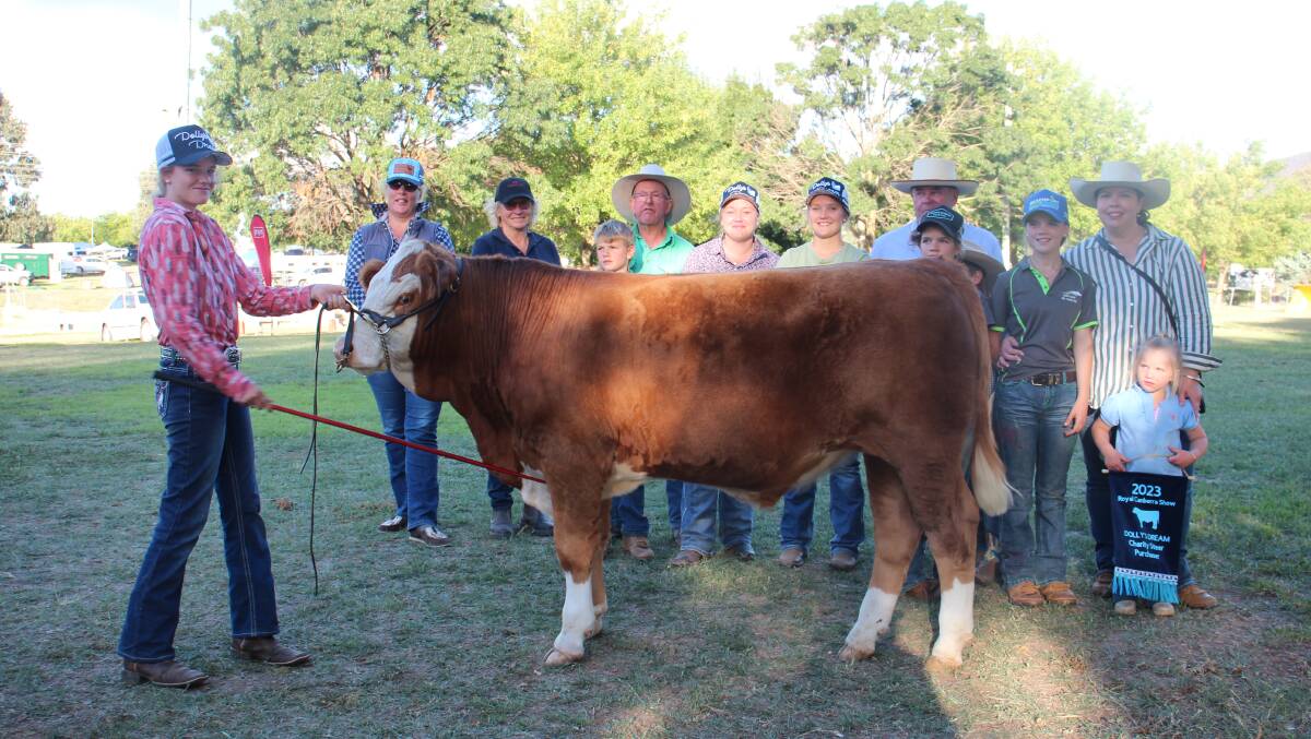 Buyers of the Fleckvieh charity steer sold for $3000. Photo: Alexandra Bernard