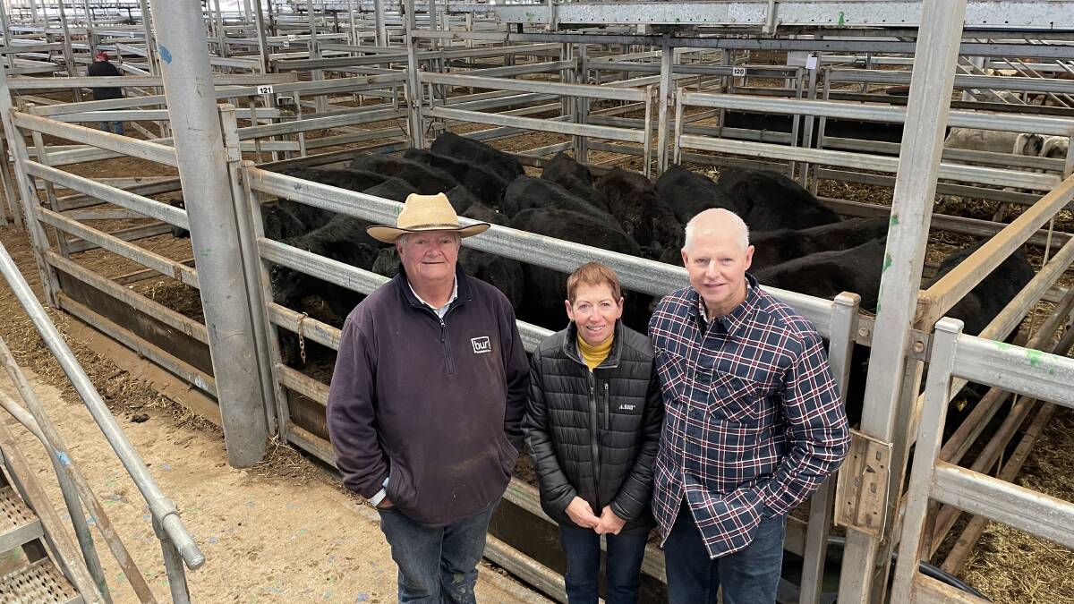 Agent Gerard Unthank, Brian Unthank, Norm and Sandy Maher, Bungowannah, with their pen of 17 8-10 months Angus heifers, 300kg, sold for $1930.
