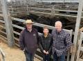 Agent Gerard Unthank, Brian Unthank, Norm and Sandy Maher, Bungowannah, with their pen of 17 8-10 months Angus heifers, 300kg, sold for $1930.