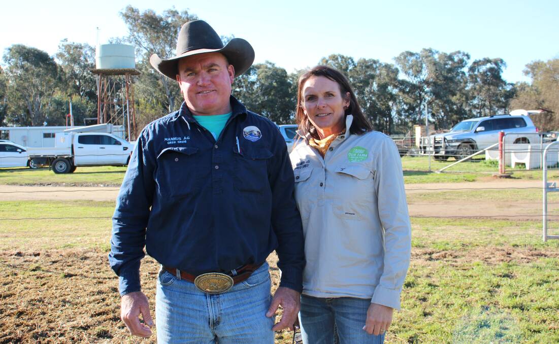 Scott and Tanya Bandy from Mannus Ag, Greg Greg, purchased the top priced bull.