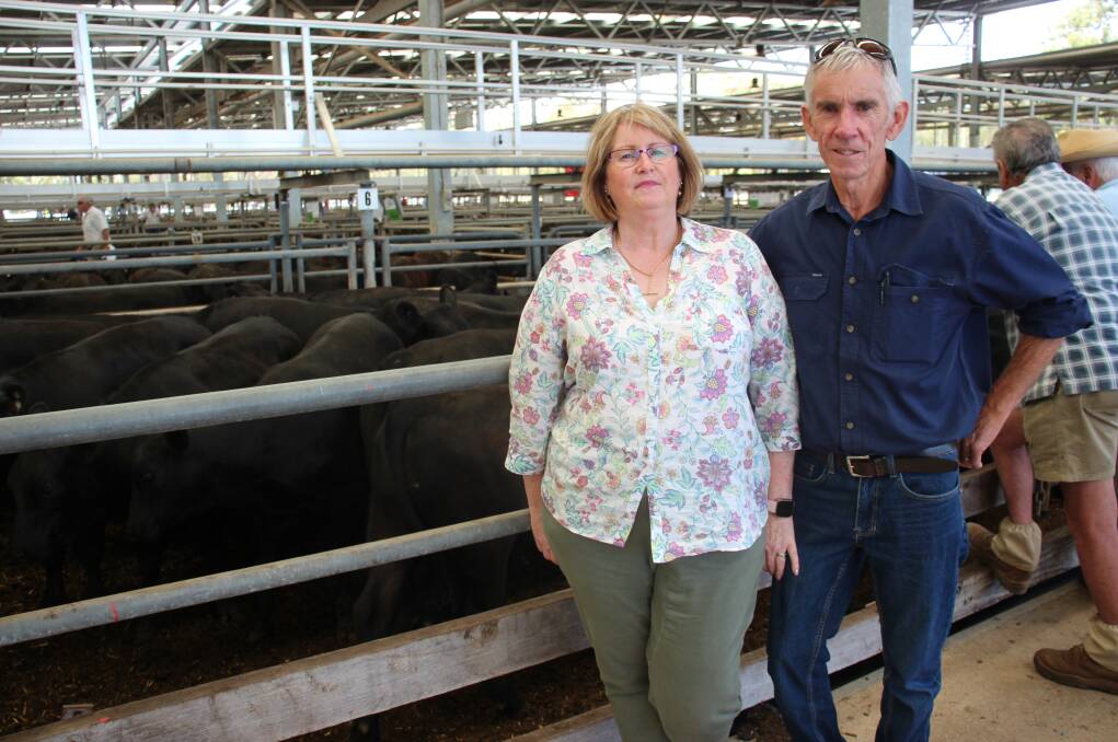 Peter and Helen Kirkbride, Baddaginnie, with their 21 Angus steers, 372kg, sold for $1860. Photo: Alexandra Bernard