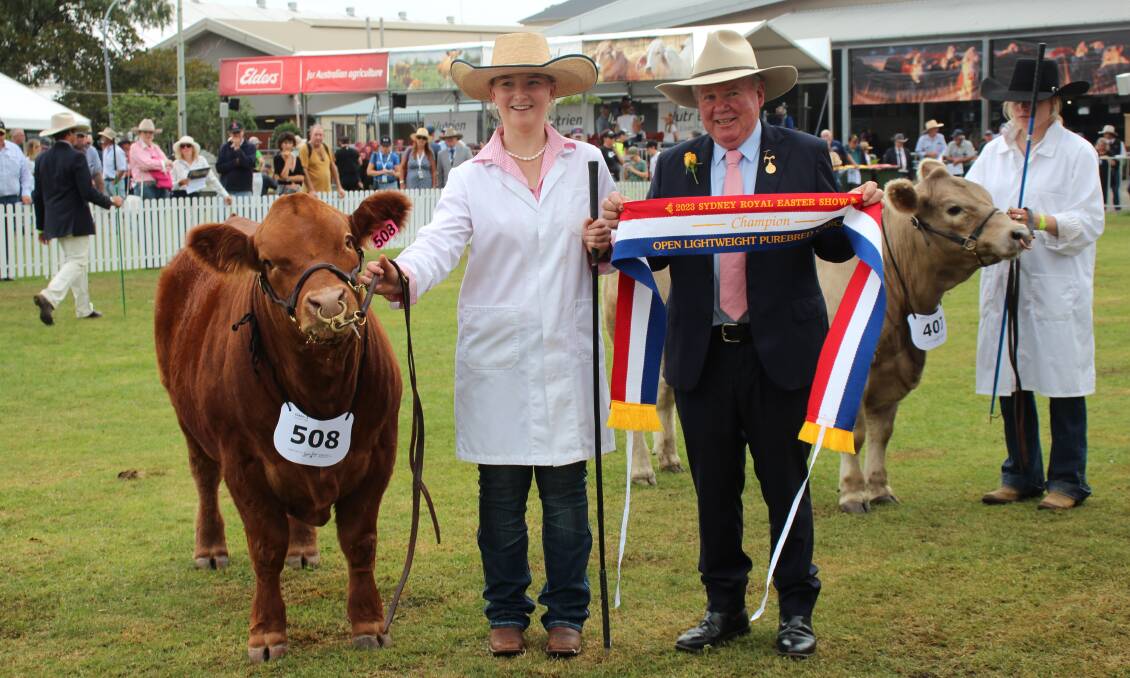 Student and breeder Laura Kirk, Scots All Saints College, Bathurst, and RAS president Michael Milner, with the champion lightweight steer. Photo by Alexandra Bernard