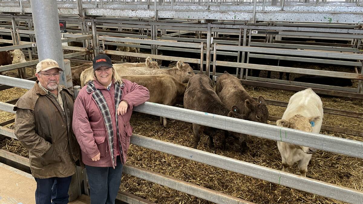 David and Kerry May, Bungowannah, with their seven Murray Grey steers, 389kg, sold for $2190.