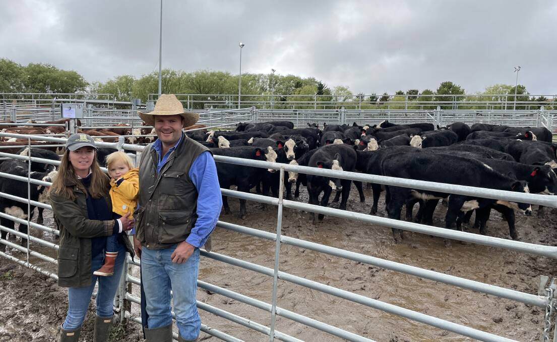 Manon, Sybella and Charlie Garnock, Sherwood Pastoral, Nimmitabel, with their pen of 57 black baldy steers sold for $1130 at Cooma on Wednesday. Photo by Alexandra Bernard