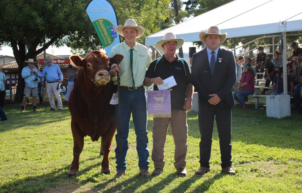Handler Scott Negus, exhibitor Warwick Hutchings and judge Matt Spry, with the jackpot bull winner. 