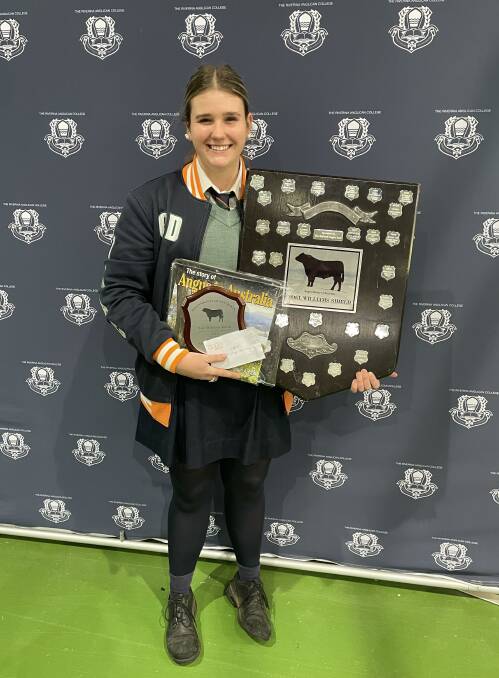 Charlotte Dendy, TRAC Cattle Team captain, with the Noel Williams Perpetual
Trophy. Picture: Supplied