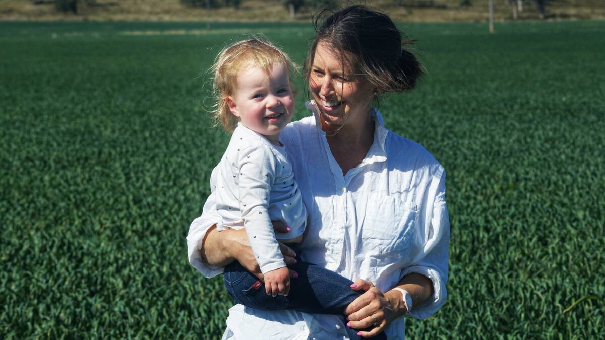Sarah and Olivia Murray, 2, on the family farm. Picture supplied.
