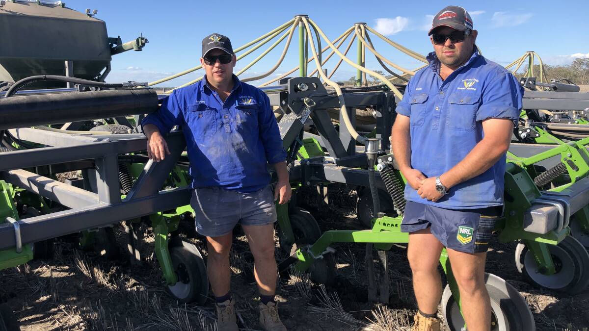 Anthony Smith and Kirian Steadman from Smith Contracting with their new 18 metre Boss Paralift Planter sowing Faba Beans at Willaroo, Goondiwindi QLD.