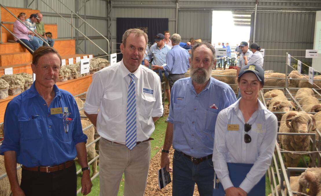 Jim and Bea Litchfield, Hazeldean, Cooma with auctioneer Paul Dooley, Tamworth and Cooma agent Brian Sears, who purchased the top priced ram on behalf of Brett Tremain, Yeoval. 